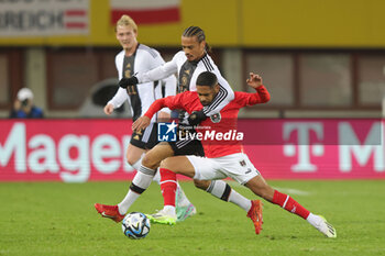 2023-11-21 - Leroy Sane of Germany and Phillipp Mwene of Austria during the International Friendly football match between Austria and Germany on November 21, 2023 at Ernst Happel Stadium in Vienna, Austria - FOOTBALL - FRIENDLY GAME - AUSTRIA V GERMANY - FRIENDLY MATCH - SOCCER