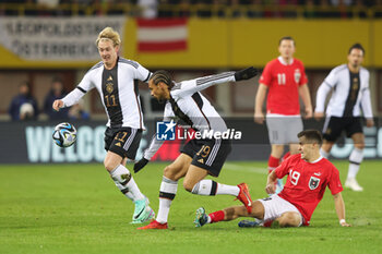 2023-11-21 - Leroy Sane, Julian Brandt of Germany and Christoph Baumgartner of Austria during the International Friendly football match between Austria and Germany on November 21, 2023 at Ernst Happel Stadium in Vienna, Austria - FOOTBALL - FRIENDLY GAME - AUSTRIA V GERMANY - FRIENDLY MATCH - SOCCER