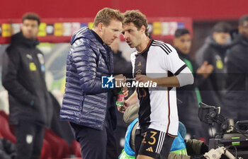 2023-11-21 - Coach Julian Nagelsmann of Germany with Thomas Müller during the International Friendly football match between Austria and Germany on November 21, 2023 at Ernst Happel Stadium in Vienna, Austria - FOOTBALL - FRIENDLY GAME - AUSTRIA V GERMANY - FRIENDLY MATCH - SOCCER
