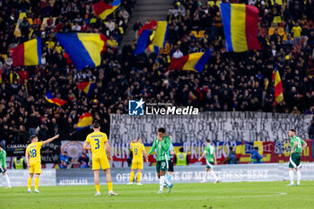 2023-12-11 - Radu Dragusin of Romania and Jamie Reid of Northern Ireland during the International Friendly football match between Romania and Northern Ireland on March 22, 2024 at Arena Nationala in Bucharest, Romania - FOOTBALL - FRIENDLY GAME - ROMANIA V NORTHERN IRELAND - FRIENDLY MATCH - SOCCER