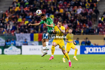 2023-12-11 - Brodie Spencer of Northern Ireland and Vasile Mogos of Romania fighting for the ball during the International Friendly football match between Romania and Northern Ireland on March 22, 2024 at Arena Nationala in Bucharest, Romania - FOOTBALL - FRIENDLY GAME - ROMANIA V NORTHERN IRELAND - FRIENDLY MATCH - SOCCER