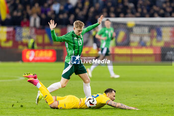 2023-12-11 - Patrick Lane of Northern Ireland and Vasile Mogos of Romania during the International Friendly football match between Romania and Northern Ireland on March 22, 2024 at Arena Nationala in Bucharest, Romania - FOOTBALL - FRIENDLY GAME - ROMANIA V NORTHERN IRELAND - FRIENDLY MATCH - SOCCER