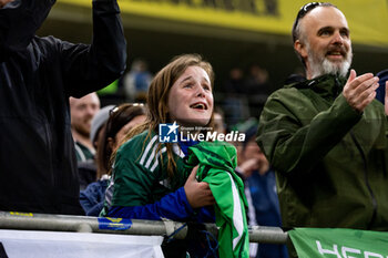 2023-12-11 - Ireland fan crying after receiving the game jersey from Isaac Price of Northern Ireland during the International Friendly football match between Romania and Northern Ireland on March 22, 2024 at Arena Nationala in Bucharest, Romania - FOOTBALL - FRIENDLY GAME - ROMANIA V NORTHERN IRELAND - FRIENDLY MATCH - SOCCER