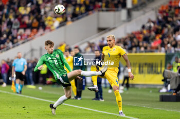 2023-12-11 - Cristian Manea of Romania and Conor Bradley of Northern Ireland during the International Friendly football match between Romania and Northern Ireland on March 22, 2024 at Arena Nationala in Bucharest, Romania - FOOTBALL - FRIENDLY GAME - ROMANIA V NORTHERN IRELAND - FRIENDLY MATCH - SOCCER