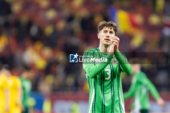 2023-12-11 - Trai Hume of Northern Ireland thanking the Northern Ireland fans after the International Friendly football match between Romania and Northern Ireland on March 22, 2024 at Arena Nationala in Bucharest, Romania - FOOTBALL - FRIENDLY GAME - ROMANIA V NORTHERN IRELAND - FRIENDLY MATCH - SOCCER