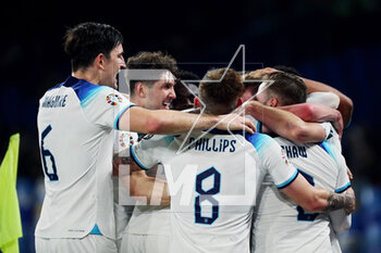 2023-03-23 - Harry Kane of England celebrates with his teammates after scoring 0-2 goal by penalty during the UEFA Euro 2024, European Qualifiers, Group C football match between Italy and England on March 23, 2023 at Stadio Diego Armando Maradona in Naples, Italy - FOOTBALL - EURO 2024 - QUALIFYING - ITALY V ENGLAND - UEFA EUROPEAN - SOCCER