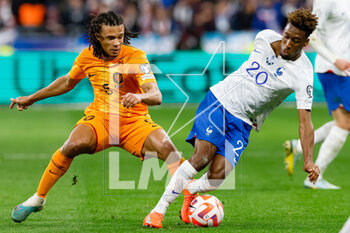 2023-03-24 - Nathan Ake of the Netherlands challenges Kingsley Coman of France during the UEFA Euro 2024, European Qualifiers, Group B football match between France and Netherlands on March 24, 2023 at Stade de France in Saint-Denis near Paris, France - FOOTBALL - EURO 2024 - QUALIFYING - FRANCE V NETHERLANDS - UEFA EUROPEAN - SOCCER