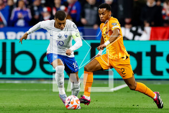 2023-03-24 - Kylian Mbappe of France is challenged by Jurrien Timber of the Netherlands during the UEFA Euro 2024, European Qualifiers, Group B football match between France and Netherlands on March 24, 2023 at Stade de France in Saint-Denis near Paris, France - FOOTBALL - EURO 2024 - QUALIFYING - FRANCE V NETHERLANDS - UEFA EUROPEAN - SOCCER