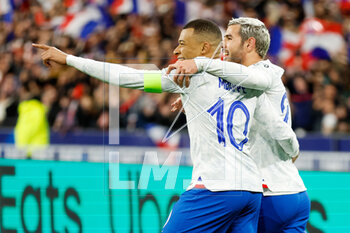 2023-03-24 - Kylian Mbappe of France celebrates with Theo Hernandez of France after scoring his sides third goal during the UEFA Euro 2024, European Qualifiers, Group B football match between France and Netherlands on March 24, 2023 at Stade de France in Saint-Denis near Paris, France - FOOTBALL - EURO 2024 - QUALIFYING - FRANCE V NETHERLANDS - UEFA EUROPEAN - SOCCER