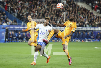 2023-03-25 - Kingsley Coman of France, Lutsharel Geertruida of Netherlands during the UEFA Euro 2024, European Qualifiers, Group B football match between France and Netherlands on March 24, 2023 at Stade de France in Saint-Denis near Paris, France - FOOTBALL - EURO 2024 - QUALIFYING - FRANCE V NETHERLANDS - UEFA EUROPEAN - SOCCER