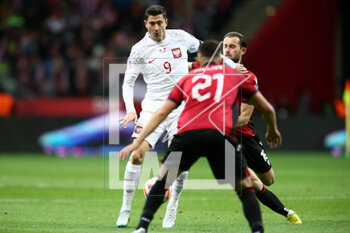 2023-03-27 - Robert Lewandowski of Poland and Sokol Cikalleshi of Albania during the UEFA Euro 2024, European Qualifiers, Group E football match between Poland and Albania on March 27, 2023 at PGE Narodowy in Warsaw, Poland - FOOTBALL - EURO 2024 - QUALIFYING - POLAND V ALBANIA - UEFA EUROPEAN - SOCCER
