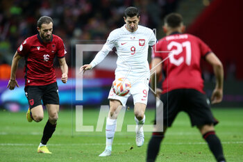 2023-03-27 - Sokol Cikalleshi of Albania and Robert Lewandowski of Poland during the UEFA Euro 2024, European Qualifiers, Group E football match between Poland and Albania on March 27, 2023 at PGE Narodowy in Warsaw, Poland - FOOTBALL - EURO 2024 - QUALIFYING - POLAND V ALBANIA - UEFA EUROPEAN - SOCCER