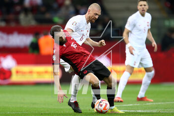 2023-03-27 - Sokol Cikalleshi of Albania and Bartosz Salamon of Poland during the UEFA Euro 2024, European Qualifiers, Group E football match between Poland and Albania on March 27, 2023 at PGE Narodowy in Warsaw, Poland - FOOTBALL - EURO 2024 - QUALIFYING - POLAND V ALBANIA - UEFA EUROPEAN - SOCCER