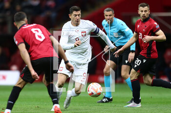 2023-03-27 - Robert Lewandowski of Poland and Ylber Ramadani of Albania during the UEFA Euro 2024, European Qualifiers, Group E football match between Poland and Albania on March 27, 2023 at PGE Narodowy in Warsaw, Poland - FOOTBALL - EURO 2024 - QUALIFYING - POLAND V ALBANIA - UEFA EUROPEAN - SOCCER