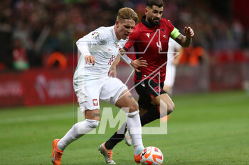 2023-03-27 - Michal Skoras of Poland and Elseid Hysaj of Albania during the UEFA Euro 2024, European Qualifiers, Group E football match between Poland and Albania on March 27, 2023 at PGE Narodowy in Warsaw, Poland - FOOTBALL - EURO 2024 - QUALIFYING - POLAND V ALBANIA - UEFA EUROPEAN - SOCCER