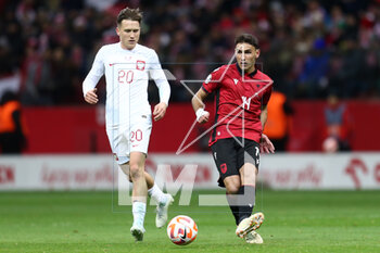 2023-03-27 - Piotr Zielinski of Poland and Qazim Laci of Albania during the UEFA Euro 2024, European Qualifiers, Group E football match between Poland and Albania on March 27, 2023 at PGE Narodowy in Warsaw, Poland - FOOTBALL - EURO 2024 - QUALIFYING - POLAND V ALBANIA - UEFA EUROPEAN - SOCCER