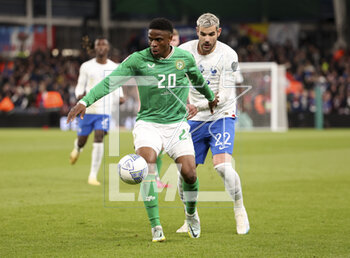 2023-03-27 - Chiedozie Ogbene of Ireland, Theo Hernandez of France during the UEFA Euro 2024, European Qualifiers, Group B football match between Republic of Ireland and France on March 27, 2023 at Dublin Arena in Dublin, Republic of Ireland - FOOTBALL - EURO 2024 - QUALIFYING - REPUBLIC OF IRELAND V FRANCE - UEFA EUROPEAN - SOCCER