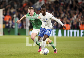 2023-03-27 - Eduardo Camavinga of France, Evan Ferguson of Ireland (left) during the UEFA Euro 2024, European Qualifiers, Group B football match between Republic of Ireland and France on March 27, 2023 at Dublin Arena in Dublin, Republic of Ireland - FOOTBALL - EURO 2024 - QUALIFYING - REPUBLIC OF IRELAND V FRANCE - UEFA EUROPEAN - SOCCER