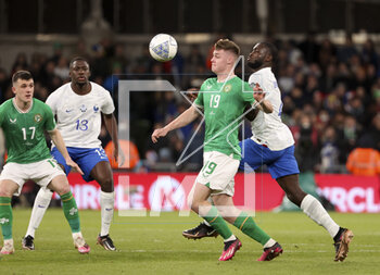 2023-03-27 - Evan Ferguson of Ireland, Dayot Upamecano of France, left Jason Knight of Ireland, Ibrahima Konate of France during the UEFA Euro 2024, European Qualifiers, Group B football match between Republic of Ireland and France on March 27, 2023 at Dublin Arena in Dublin, Republic of Ireland - FOOTBALL - EURO 2024 - QUALIFYING - REPUBLIC OF IRELAND V FRANCE - UEFA EUROPEAN - SOCCER