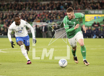 2023-03-27 - Matthew Doherty of Ireland, Moussa Diaby of France (left) during the UEFA Euro 2024, European Qualifiers, Group B football match between Republic of Ireland and France on March 27, 2023 at Dublin Arena in Dublin, Republic of Ireland - FOOTBALL - EURO 2024 - QUALIFYING - REPUBLIC OF IRELAND V FRANCE - UEFA EUROPEAN - SOCCER