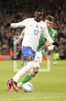 2023-03-27 - Rando Kolo Muani of France, Dara O’Shea of Ireland during the UEFA Euro 2024, European Qualifiers, Group B football match between Republic of Ireland and France on March 27, 2023 at Dublin Arena in Dublin, Republic of Ireland - FOOTBALL - EURO 2024 - QUALIFYING - REPUBLIC OF IRELAND V FRANCE - UEFA EUROPEAN - SOCCER