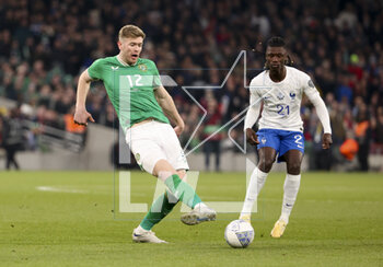 2023-03-27 - Nathan Collins of Ireland, Eduardo Camavinga of France during the UEFA Euro 2024, European Qualifiers, Group B football match between Republic of Ireland and France on March 27, 2023 at Dublin Arena in Dublin, Republic of Ireland - FOOTBALL - EURO 2024 - QUALIFYING - REPUBLIC OF IRELAND V FRANCE - UEFA EUROPEAN - SOCCER