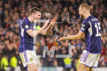 2023-03-28 - Andy Robertson and Ryan Porteous of Scotland celebrate after the UEFA Euro 2024, European Qualifiers, Group A football match between Scotland and Spain on March 28, 2023 at Hampden Park in Glasgow, Scotland - FOOTBALL - EURO 2024 - QUALIFYING - SCOTLAND V SPAIN - UEFA EUROPEAN - SOCCER