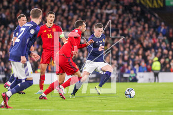 2023-03-28 - Callum McGregor of Scotland and Borja Iglesias of Spain during the UEFA Euro 2024, European Qualifiers, Group A football match between Scotland and Spain on March 28, 2023 at Hampden Park in Glasgow, Scotland - FOOTBALL - EURO 2024 - QUALIFYING - SCOTLAND V SPAIN - UEFA EUROPEAN - SOCCER