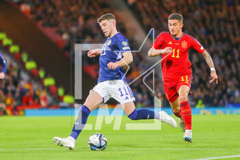 2023-03-28 - Ryan Christie of Scotland and Yeremi Pino of Spain during the UEFA Euro 2024, European Qualifiers, Group A football match between Scotland and Spain on March 28, 2023 at Hampden Park in Glasgow, Scotland - FOOTBALL - EURO 2024 - QUALIFYING - SCOTLAND V SPAIN - UEFA EUROPEAN - SOCCER