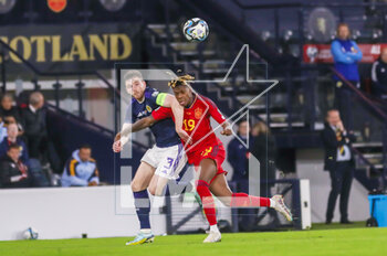 2023-03-28 - Andy Robertson of Scotland and Nico Williams of Spain during the UEFA Euro 2024, European Qualifiers, Group A football match between Scotland and Spain on March 28, 2023 at Hampden Park in Glasgow, Scotland - FOOTBALL - EURO 2024 - QUALIFYING - SCOTLAND V SPAIN - UEFA EUROPEAN - SOCCER