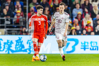 2023-03-28 - Wales' defender Neco Williams (3) under pressure from Latvian midfielder Janis Ikaunieks (10) during the UEFA Euro 2024, European Qualifiers football match between Wales and Latvia on 28 March 2023 at the Cardiff City Stadium in Cardiff, Wales - FOOTBALL - EURO 2024 - QUALIFYING - WALES V LATVIA - UEFA EUROPEAN - SOCCER