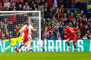 2023-03-28 - Wales' forward Kiefer Moore (13) scores his side's first goal during the UEFA Euro 2024, European Qualifiers football match between Wales and Latvia on 28 March 2023 at the Cardiff City Stadium in Cardiff, Wales - FOOTBALL - EURO 2024 - QUALIFYING - WALES V LATVIA - UEFA EUROPEAN - SOCCER