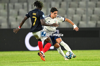 2023-06-22 - Italy U21’s Matteo Cancellieri and France U21’s Kouadio Kone in action during the first qualifying round UEFA European Under-21 Championship 2023 soccer match Italy U21 vs. France U21 at the Cluj Arena stadium in Cluj Napoca, Romania, 22nd of June 2023 - UNDER 21 MEN - FRANCE VS ITALY - UEFA EUROPEAN - SOCCER