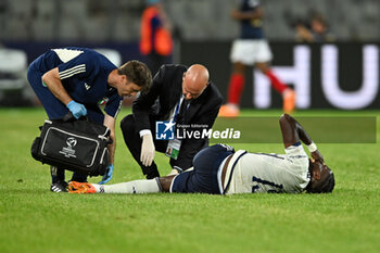 2023-06-22 - Italy U21’s Caleb Okoli injury during the scores a goal of France U21 during the first qualifying round UEFA European Under-21 Championship 2023 soccer match Italy U21 vs. France U21 at the Cluj Arena stadium in Cluj Napoca, Romania, 22nd of June 2023 - UNDER 21 MEN - FRANCE VS ITALY - UEFA EUROPEAN - SOCCER