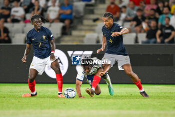 2023-06-22 - Clash between France U21’s Loic Bade and Italy U21’s Iyenoma Destiny Udogie during the first qualifying round UEFA European Under-21 Championship 2023 soccer match Italy U21 vs. France U21 at the Cluj Arena stadium in Cluj Napoca, Romania, 22nd of June 2023 - UNDER 21 MEN - FRANCE VS ITALY - UEFA EUROPEAN - SOCCER