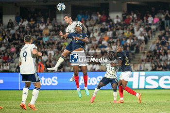 2023-06-22 - Italy U21’s Pietro Pellegri overhead kick against dFrance U21’s Mohamed Simakan during the first qualifying round UEFA European Under-21 Championship 2023 soccer match Italy U21 vs. France U21 at the Cluj Arena stadium in Cluj Napoca, Romania, 22nd of June 2023 - UNDER 21 MEN - FRANCE VS ITALY - UEFA EUROPEAN - SOCCER