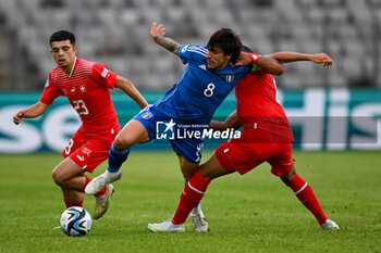 2023-06-25 - Foul play of Swiss U21’s Lewin Blum on Italy U21’s Sandro Tonali during the first qualifying round UEFA European Under-21 Championship 2023 soccer match Italy U21 vs. Swiss U21 at the Cluj Arena stadium in Cluj Napoca, Romania, 25nd of June 2023 - UNDER 21 MEN - SWITZERLAND VS ITALY - UEFA EUROPEAN - SOCCER
