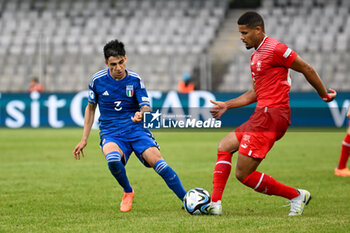 2023-06-25 - Swiss U21’s Nicolas Vouilloz and Italy U21’s Fabiano Parisi in action during the first qualifying round UEFA European Under-21 Championship 2023 soccer match Italy U21 vs. Swiss U21 at the Cluj Arena stadium in Cluj Napoca, Romania, 25nd of June 2023 - UNDER 21 MEN - SWITZERLAND VS ITALY - UEFA EUROPEAN - SOCCER
