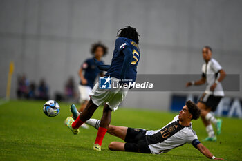 2023-06-02 - Germany U17’s Noah Darvich trying to stop France U17’s Bastien Meupiyou during the final phase Under-17 Championship Hungary 2023 soccer match Germany U17 vs. France U17 at the Nandor Hidegkuti Stadion stadium in Budapest, Hungary, 2nd of June 2023 - UNDER 17 FINAL - GERMANY VS FRANCE - UEFA EUROPEAN - SOCCER