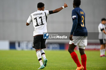 2023-06-02 - Germany U17’s Charles Hermann say thank's to teammate for nice pass during the final phase Under-17 Championship Hungary 2023 soccer match Germany U17 vs. France U17 at the Nandor Hidegkuti Stadion stadium in Budapest, Hungary, 2nd of June 2023 - UNDER 17 FINAL - GERMANY VS FRANCE - UEFA EUROPEAN - SOCCER