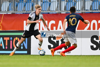 2023-06-02 - Germany U17’s Max Moerstedt and France U17’s Ismail Bouneb during the final phase Under-17 Championship Hungary 2023 soccer match Germany U17 vs. France U17 at the Nandor Hidegkuti Stadion stadium in Budapest, Hungary, 2nd of June 2023 - UNDER 17 FINAL - GERMANY VS FRANCE - UEFA EUROPEAN - SOCCER