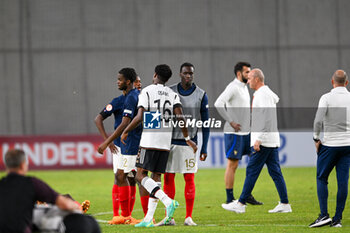 2023-06-02 - Germany U17’s Winners Osawe goes to console France U17 team after have lost the final phase Under-17 Championship Hungary 2023 soccer match vs. France U17 at the Nandor Hidegkuti Stadion stadium in Budapest, Hungary, 2nd of June 2023 - UNDER 17 FINAL - GERMANY VS FRANCE - UEFA EUROPEAN - SOCCER
