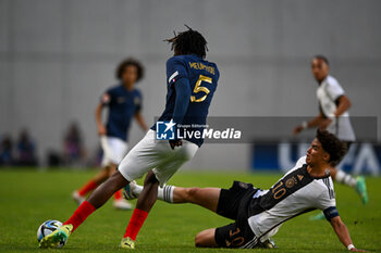2023-06-02 - France U17’s Bastien Meupiyou and Germany U17’s Noah Darvich in action during the final phase Under-17 Championship Hungary 2023 soccer match Germany U17 vs. France U17 at the Nandor Hidegkuti Stadion stadium in Budapest, Hungary, 2nd of June 2023 - UNDER 17 FINAL - GERMANY VS FRANCE - UEFA EUROPEAN - SOCCER