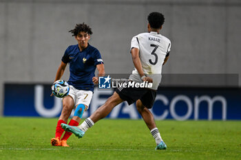 2023-06-02 - France U17’s Mohammed-Amine Boucehnna and Germany U17’s Almugera Kabar during the final phase Under-17 Championship Hungary 2023 soccer match Germany U17 vs. France U17 at the Nandor Hidegkuti Stadion stadium in Budapest, Hungary, 2nd of June 2023 - UNDER 17 FINAL - GERMANY VS FRANCE - UEFA EUROPEAN - SOCCER