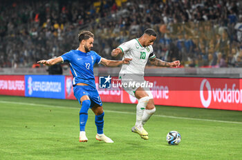 2023-06-16 - 10 ADAM IDAH of the Republic of Ireland conpeting with 17 PANTELIS HATZIDIAKOS of Greece during the UEFA EURO 2024 qualifying round group B match between Greece and the Republic of Ireland at OPAP Arena on May 16, 2023, in Athens, Greece. - QUALIFICATIONS - GREECE VS IRELAND - UEFA EUROPEAN - SOCCER