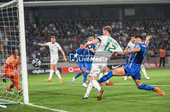 2023-06-16 - 12 NATHAN COLLINS of the Republic of Ireland scoring during the UEFA EURO 2024 qualifying round group B match between Greece and the Republic of Ireland at OPAP Arena on May 16, 2023, in Athens, Greece. - QUALIFICATIONS - GREECE VS IRELAND - UEFA EUROPEAN - SOCCER