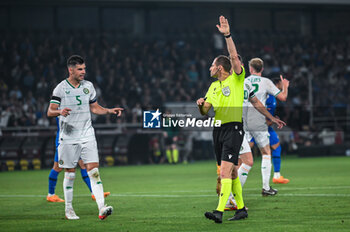 2023-06-16 - 5 JOHN EGAN of the Republic of Ireland with referee during the UEFA EURO 2024 qualifying round group B match between Greece and the Republic of Ireland at OPAP Arena on May 16, 2023, in Athens, Greece. - QUALIFICATIONS - GREECE VS IRELAND - UEFA EUROPEAN - SOCCER