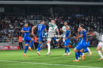 2023-06-16 - 17 PANTELIS HATZIDIAKOS of Greece competing with 5 JOHN EGAN of the Republic of Ireland during the UEFA EURO 2024 qualifying round group B match between Greece and the Republic of Ireland at OPAP Arena on May 16, 2023, in Athens, Greece. - QUALIFICATIONS - GREECE VS IRELAND - UEFA EUROPEAN - SOCCER