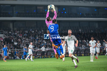 2023-06-16 - 1 GAVIN BAZUNU of the Republic of Ireland competing with 9 VANGELIS PAVLIDIS of Greece during the UEFA EURO 2024 qualifying round group B match between Greece and the Republic of Ireland at OPAP Arena on May 16, 2023, in Athens, Greece. - QUALIFICATIONS - GREECE VS IRELAND - UEFA EUROPEAN - SOCCER