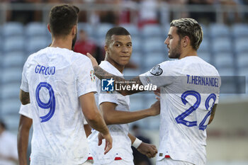2023-06-16 - Kylian Mbappe of France celebrates his goal with Theo Hernandez, left Olivier Giroud during the UEFA Euro 2024, European Qualifiers, Group B, football match between Gibraltar and France on June 16, 2023 at Estadio Algarve in Faro, Portugal - FOOTBALL - EURO 2024 - QUALIFYING - GIBRALTAR V FRANCE - UEFA EUROPEAN - SOCCER